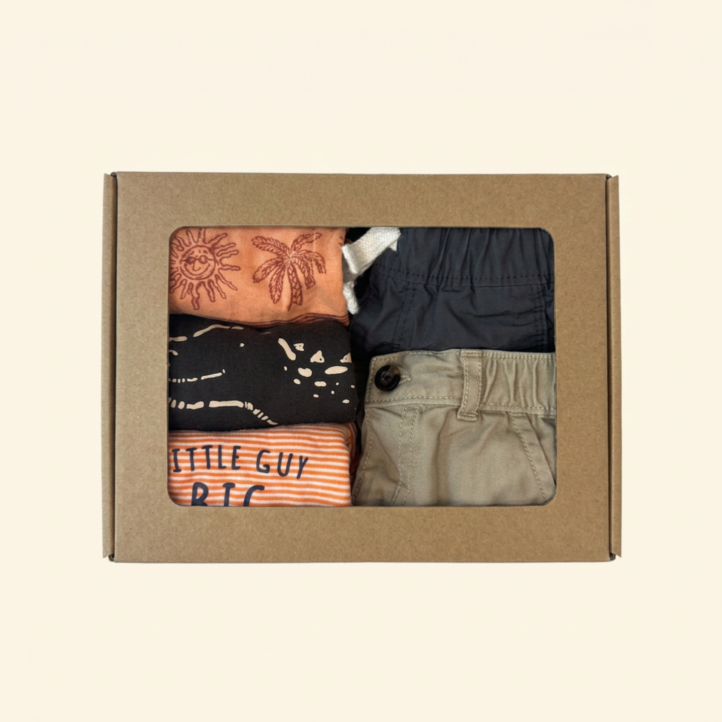 orange and gray baby boy clothes beautifully styled in a cardboard gift box