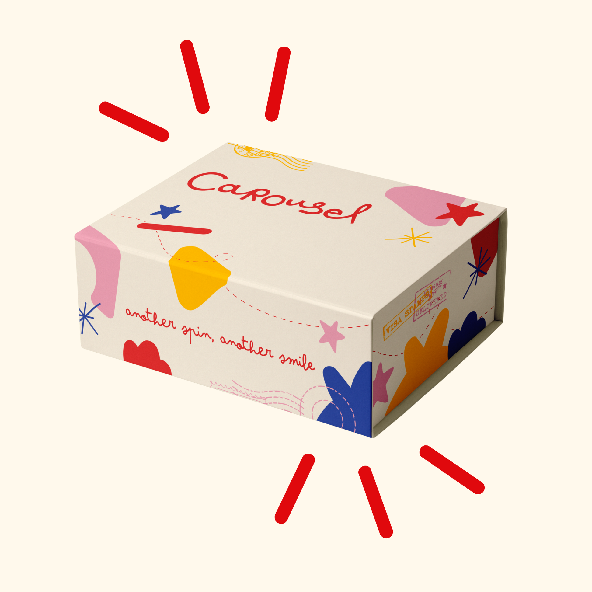 A rectangular product box with a cream background and colorful abstract shapes, featuring the word 'Carousel' and the phrase 'another spin, another smile' on the front. The box is shown on a light cream background with red radiating line graphics around it.