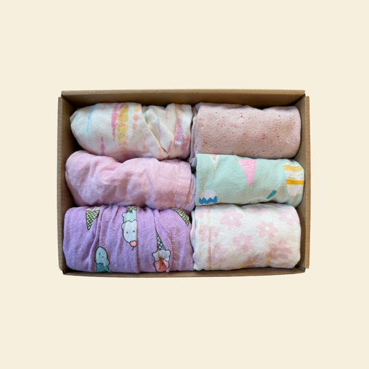 box of girl's clothing featuring ice cream printed styles and six pieces total